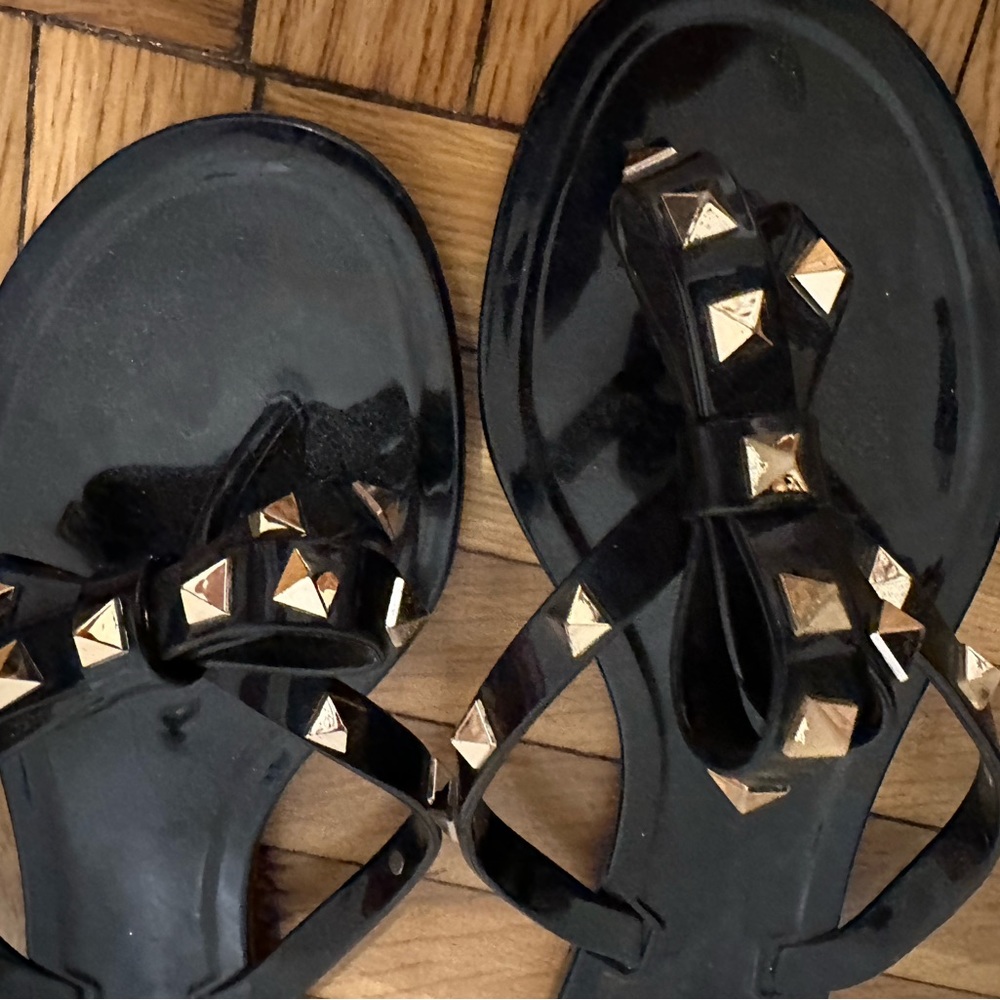 Valentino barely worn flip flops, black and gold